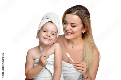 Happy mother with daughter in white towels isolated on white
