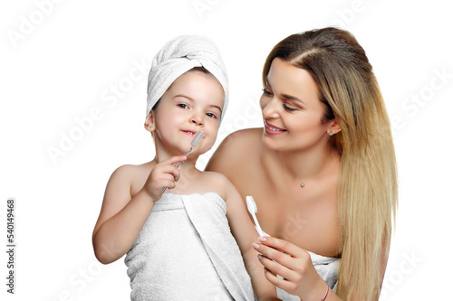 Little girl in a white towel with her toothbrush