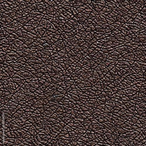 The surface is smooth and unbroken, like glass. The leather is a deep, rich brown color with a slight sheen to it. It's soft to the touch, but firm and sturdy. photo