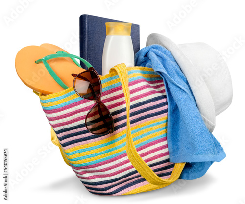 Photography Vacations Concept, Colorful Bag with beach items on Summer Beach