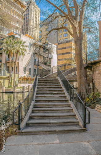Stairs going up a building overlooking the canal in San Antonio River Walk Texas