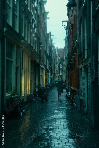 Photography person with umbrella in the alley