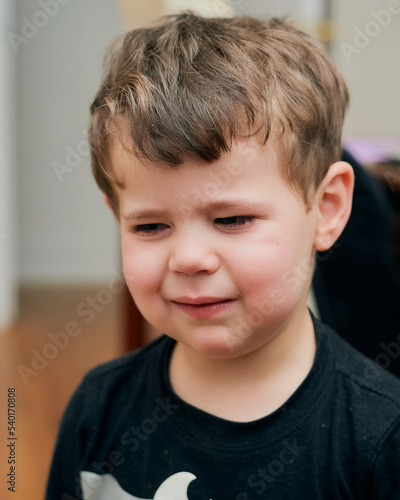 Upset young boy is crying and whining