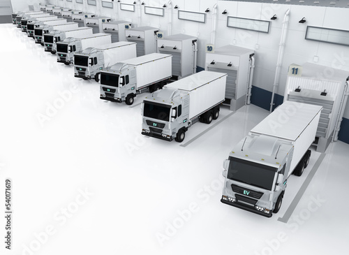 Group of logistic trailer trucks or lorries at warehouse