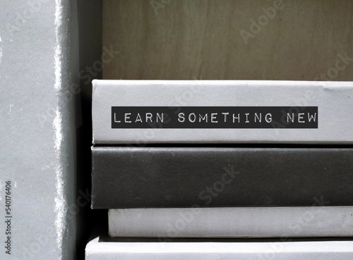 Slika na platnu Books spine with text written affirmation LEARN SOMETHING NEW, commitment remind