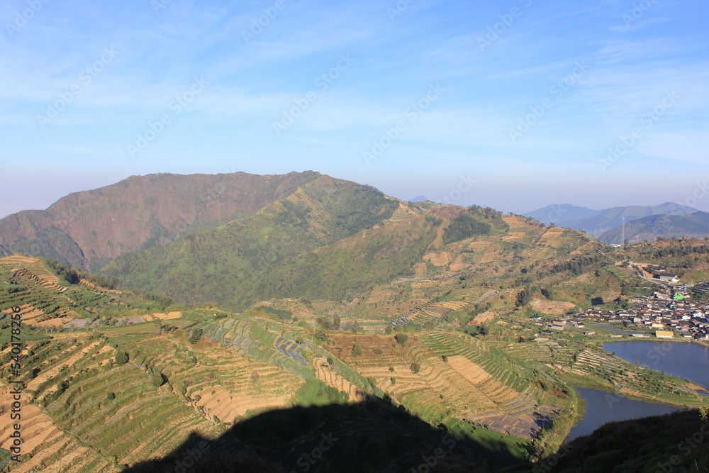 Obraz premium beautiful view of farmland from the top of the mountain