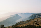 View from Mount Lovcen to the fog over the Bay of Kotor at sunset