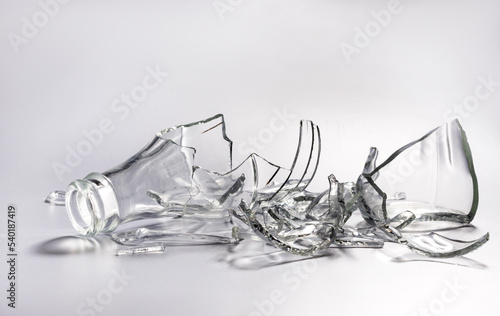 Canvas Print Broken glass bottle. Sharp shards of clear glass.