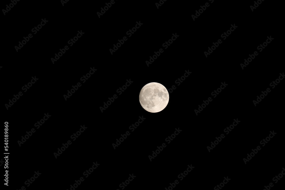 Full moon in the black starless sky at night Full moon in the black starless sky at night