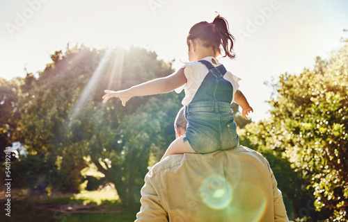 фотографія Back, child and father walking in a park for freedom, care and love together in summer