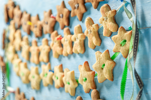 Rustic butter cookies chain as Christmas ornaments.