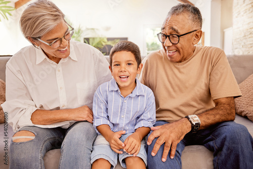 Relax, happy and grandparents with child on sofa together for smile, love and retirement. Peace, youth and portrait of old man and woman with kid in living room in family home for care, hug and calm