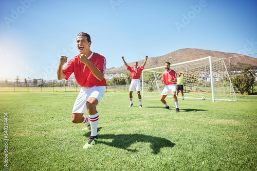 Man, soccer and team winner in celebration for sports victory, score or goal on the field in the outdoors. Happy male football player celebrating win, teamwork or achievement in sport fitness outside