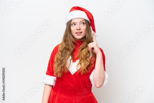 Young caucasian woman with Christmas dress isolated on white background thinking an idea pointing the finger up