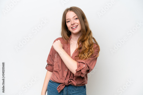 Young pretty woman isolated on white background celebrating a victory © luismolinero