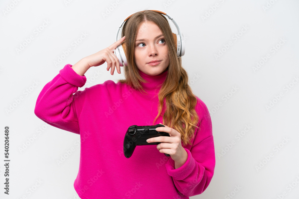Young pretty woman playing with a video game controller isolated on white background having doubts and thinking Young pretty woman playing with a video game controller isolated on white background having doubts and thinking