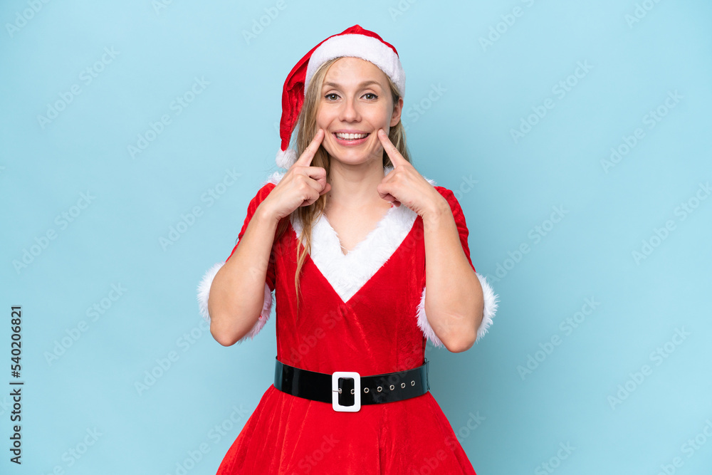 Young blonde woman dressed as mama claus isolated on blue background smiling with a happy and pleasant expression Young blonde woman dressed as mama claus isolated on blue background smiling with a happy and pleasant expression