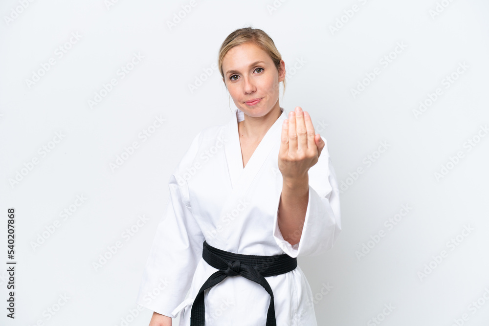 Young caucasian woman isolated on white background inviting to come with hand. Happy that you came Young caucasian woman isolated on white background inviting to come with hand. Happy that you came