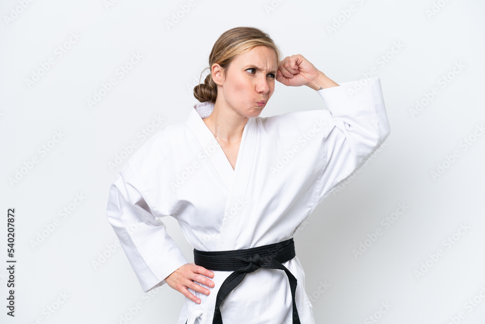 Young caucasian woman isolated on white background having doubts and with confuse face expression Young caucasian woman isolated on white background having doubts and with confuse face expression