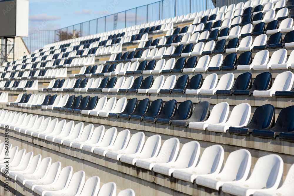 Fototapeta premium Empty black and white Plastic Chairs at the spotr Stadium