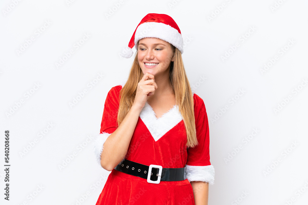Young caucasian woman dressed as mama noel isolated on white background looking to the side and smiling Young caucasian woman dressed as mama noel isolated on white background looking to the side and smiling