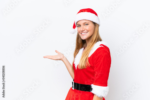 Young caucasian woman dressed as mama noel isolated on white background extending hands to the side for inviting to come