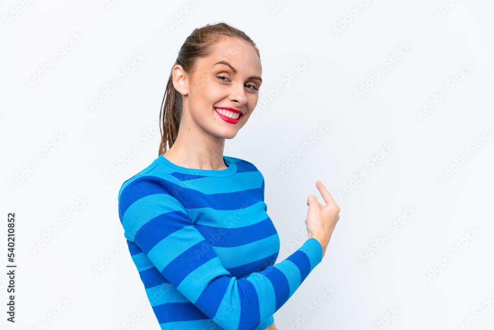 Young caucasian woman isolated on white background pointing back Young caucasian woman isolated on white background pointing back