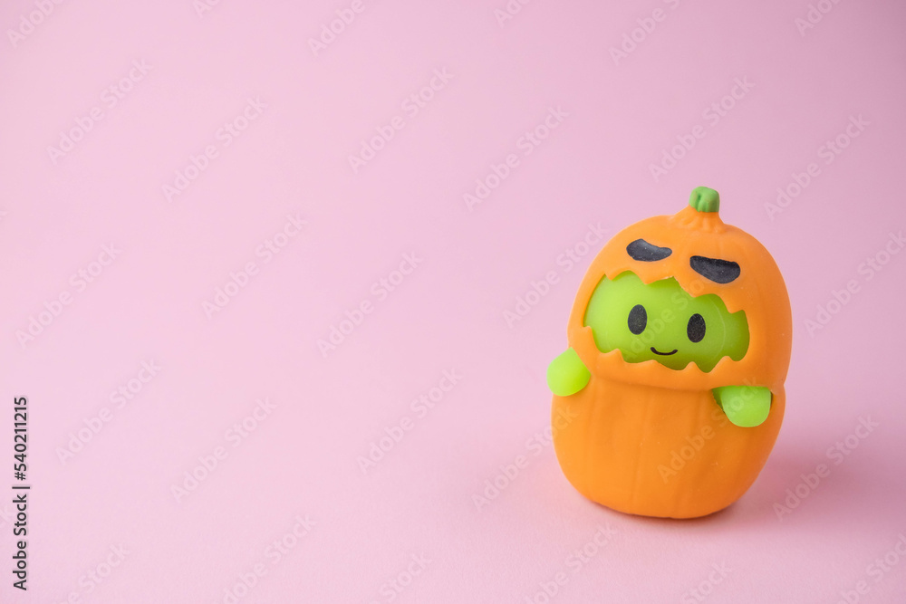 children's monsters for Halloween on pink and orange background , the concept of a children's holiday