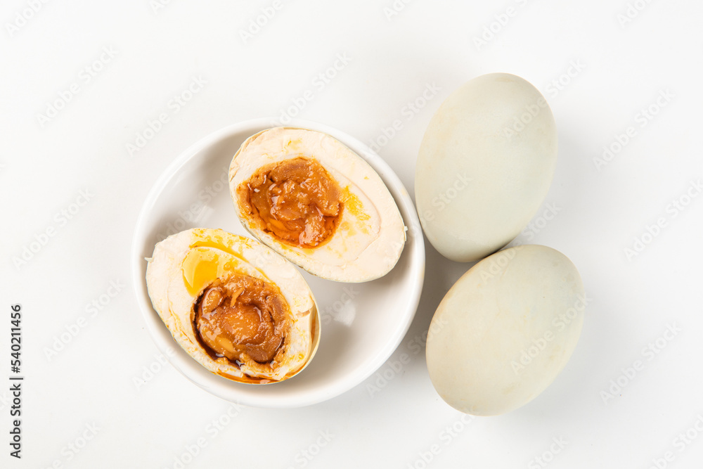 preserved Salted duck eggs with egg yolk on white background preserved Salted duck eggs with egg yolk on white background