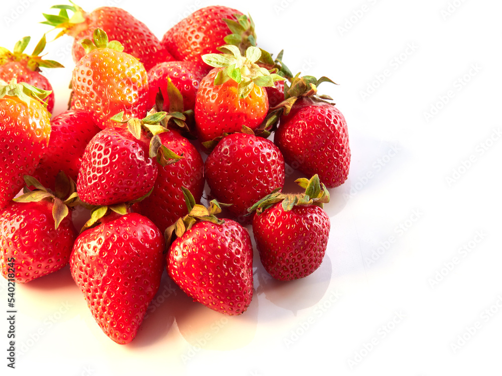 Fresh, red and delicious strawberries on a light background