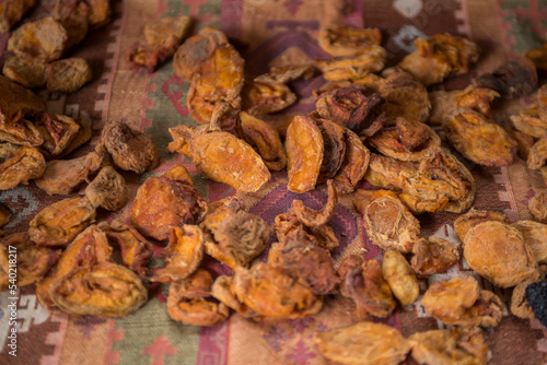 close-up shot of dried apples on rustic cloth