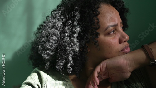 Photography One young black woman sitting at home sofa daydreaming lying on couch