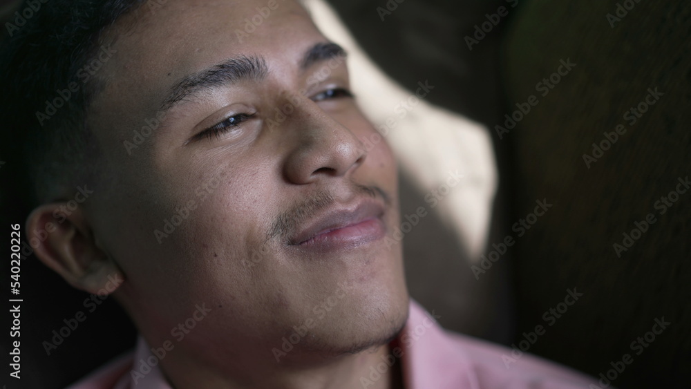 Fototapeta premium One confident happy hispanic man lying in bed feeling satisfied