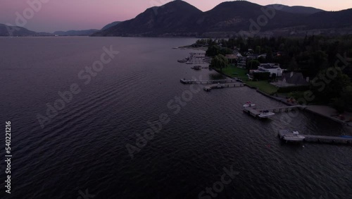 High end waterfront property with boat docks on Skaha Lake, Okanagan, BC, sunset lake, boats, luxury life. 4K 24FPS photo