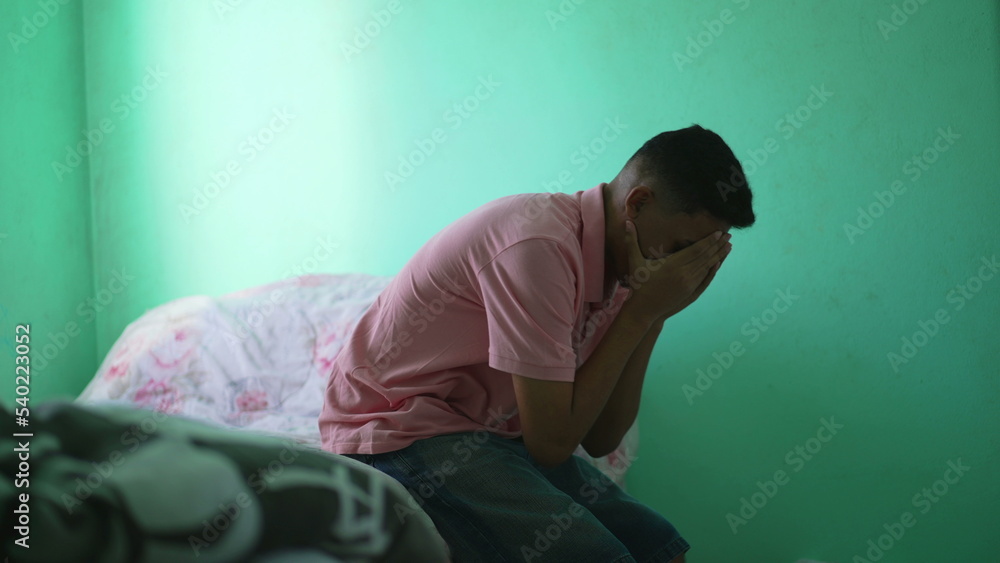 Frustrated person covering face feeling anxiety. Man suffering from mental illness Frustrated person covering face feeling anxiety. Man suffering from mental illness