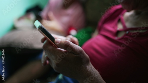 Closeup senior woman hands holding phone