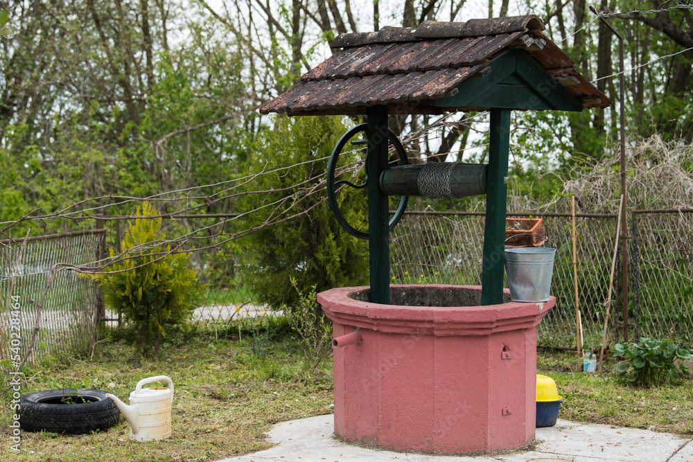 Croatia, May 01,2022: Well for drawing water located in the countryside. Croatia, May 01,2022: Well for drawing water located in the countryside.