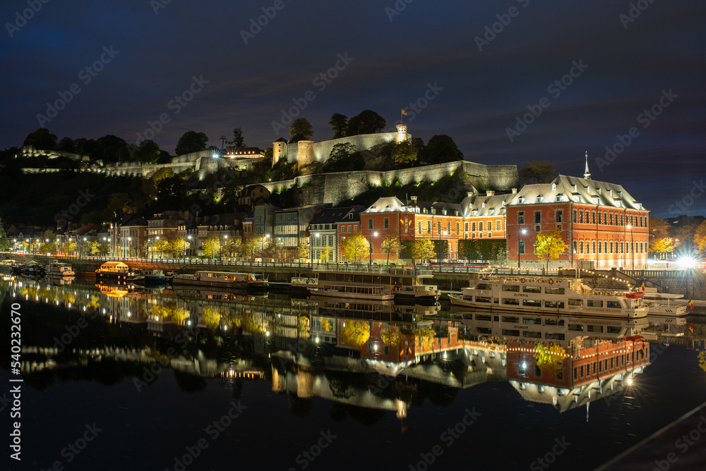 night view of namur from the riverside of river meuse.