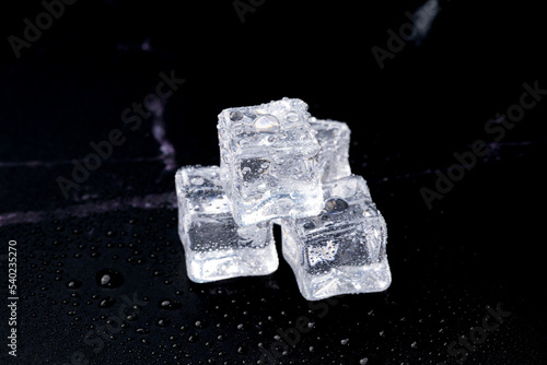 ice cubes on a black background © Rurgrit