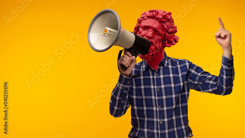 Abstract modern collage. The man with the plaster head of David with a megaphone on yellow background