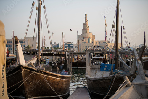 Canvas-taulu Doha,Qatar- April 24,2022 Traditional boats called Dhows are anchored in the port near the Museum of Islamic Art Park