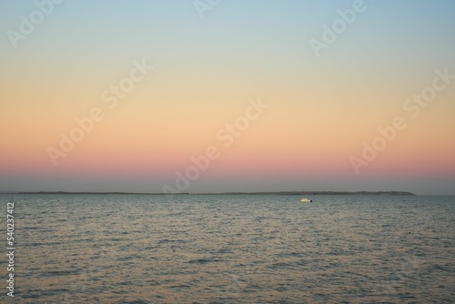 Breathtaking view of pastel pink sunrise while looking towards the Isle of Sheppey in Kent, UK