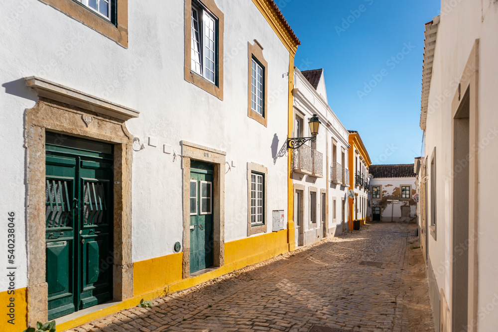 Portugal, August 2022: Street and traditional houses in the city of Faro, Algarve, Portugal