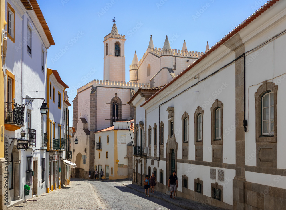 Portugal, August 2022: Traditional street with typical white buildings in Évora, Algarve, Portugal