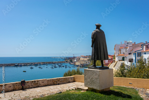 Portugal, August 2022: Vasco da Gama sculpture looking at the Atlantic ocean in his hometown Sines, Portugal