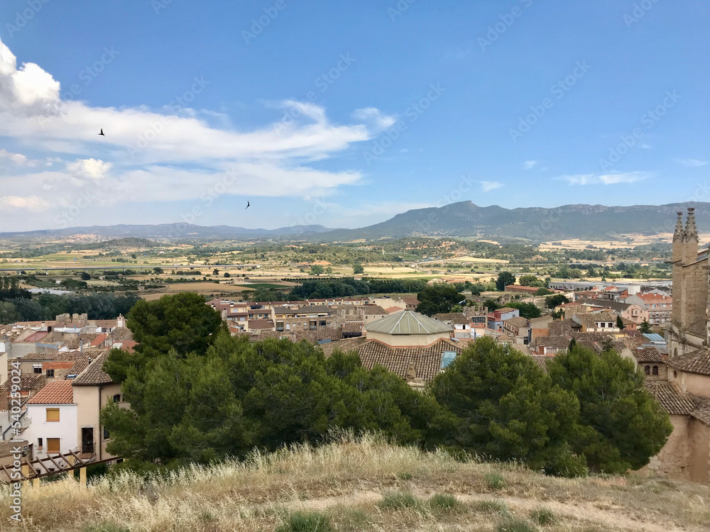 Montblanc, Spain, June 2019 - A large building with a mountain in the background
