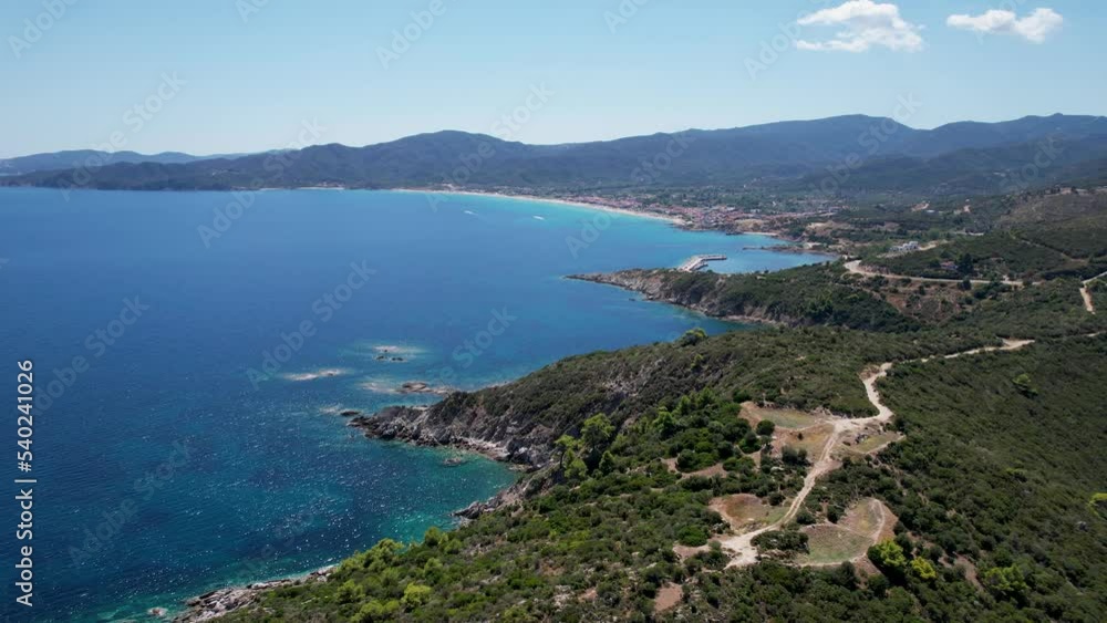 Aerial view of Halkidiki peninsula in Greece. Drone shot of Atos mountain with clear blue water on a sunny day Aerial view of Halkidiki peninsula in Greece. Drone shot of Atos mountain with clear blue water on a sunny day