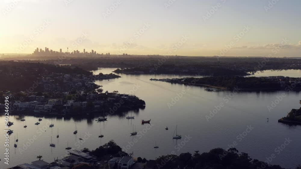 Sydney city skyline at sunrise in aerial flying from Parramatta river as 4k.
Sydney city skyline at sunrise in aerial flying from Parramatta river as 4k.