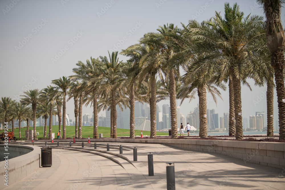 Doha,Qatar - March 05, 2019 : People enjoying a sunny day in the park of the Museum of Islamic Art in Doha.