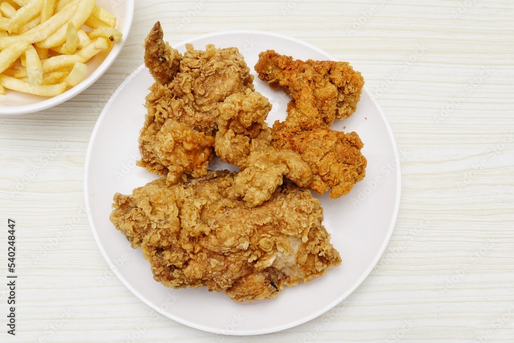 Close up of fried chicken and french fries Close up of fried chicken and french fries